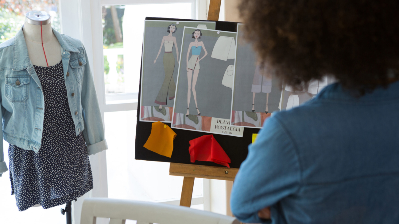 Female fashion standing near bulletin board at home