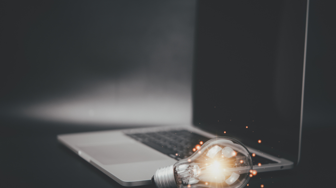 light bulb with laptop computer. Self learning or education knowledge idea of inspiration from online technology innovation concept.